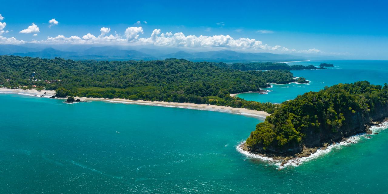 Aerial view of the Pacific coast and forested headland at Manuel Antonio, Costa Rica