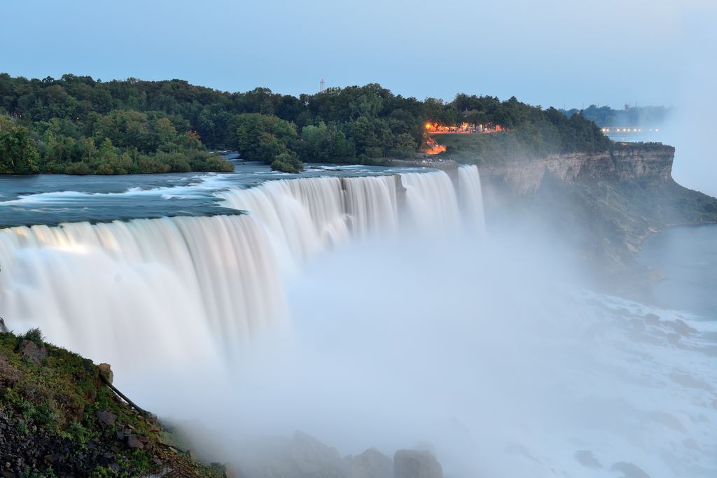 The American Falls at Niagara at dusk, the water smoothed by a long exposure