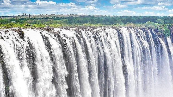 Victoria Falls Guided Tour in Zambia with Fees, Water and Air-Conditioned Vehicle (1/7)