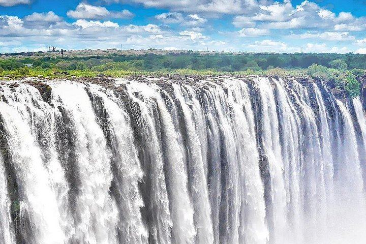Victoria Falls Guided Tour in Zambia with Fees, Water and Air-Conditioned Vehicle (1/7)