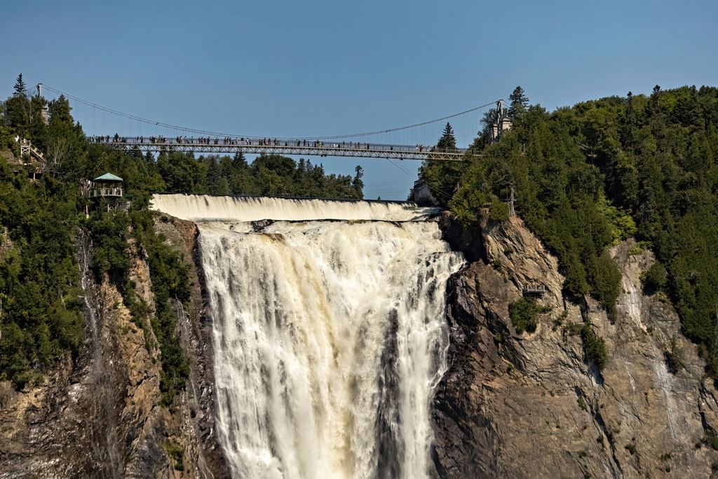Montmorency Falls seen from the river with the staircase on the cliff at right, Quebec