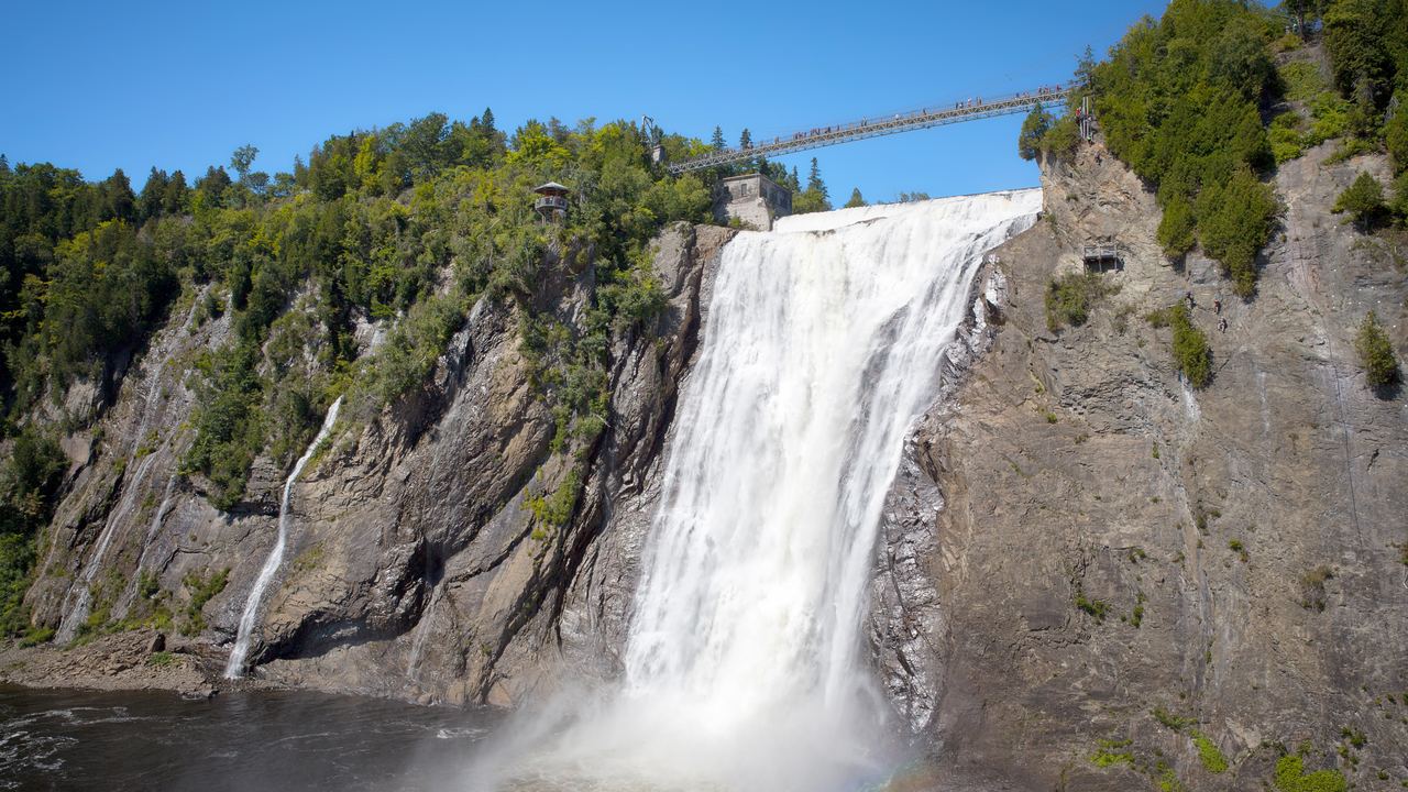 Montmorency Falls in summer with the suspension bridge across the crest, Quebec City, Canada
