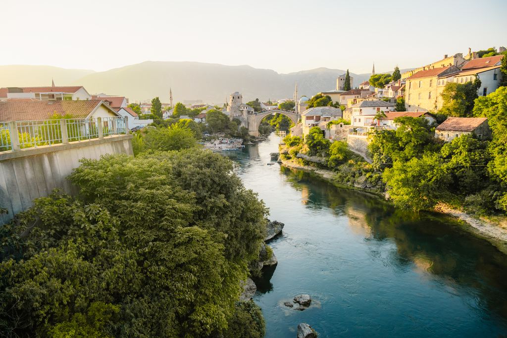 The Neretva river and the Old Bridge in the distance at Mostar, Bosnia and Herzegovina