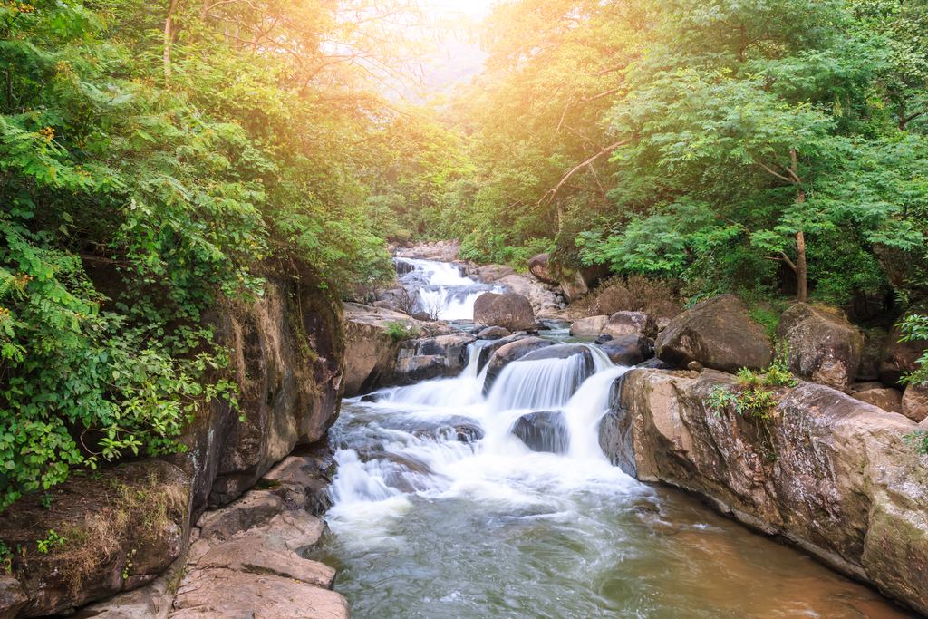 Nang Rong waterfall running over rocks in Khao Yai National Park, Thailand