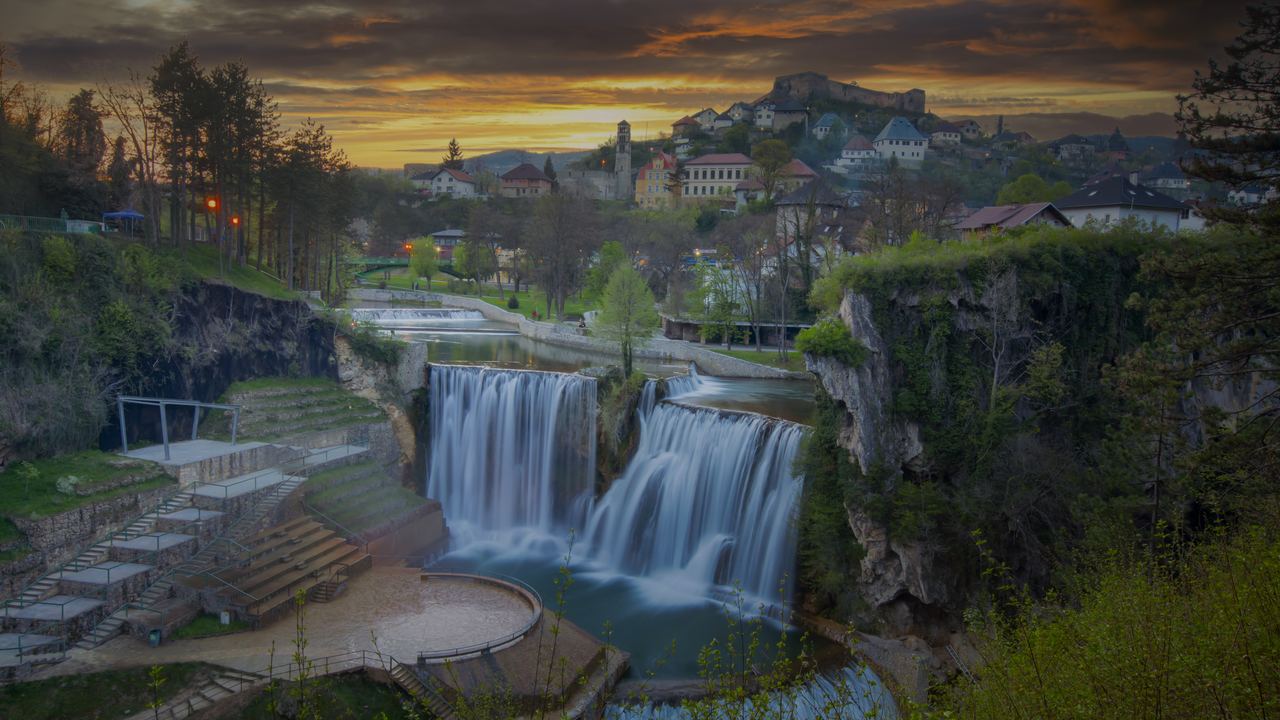 Pliva waterfall in the town of Jajce, Bosnia and Herzegovina, at sunset