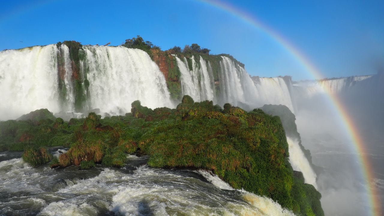 Rainbow over the cascades at Iguazú Falls in Iguazú National Park, Argentina