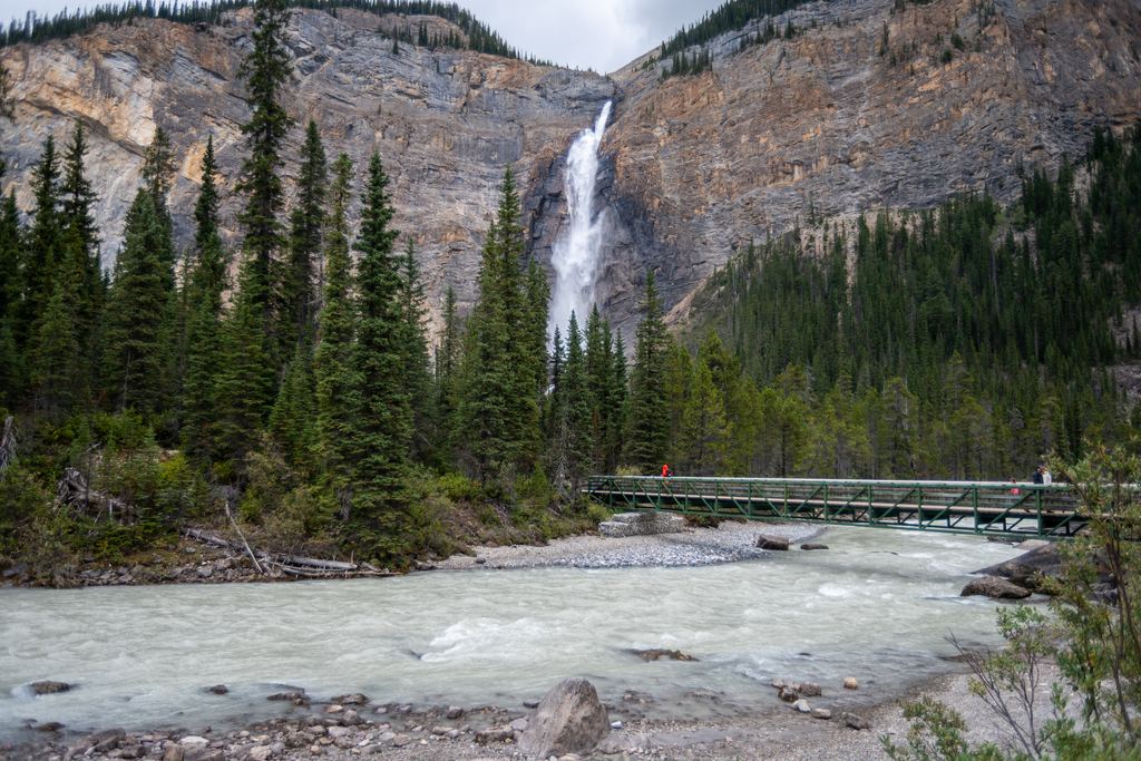 Takakkaw Falls above the Yoho River and a footbridge in Yoho National Park, British Columbia