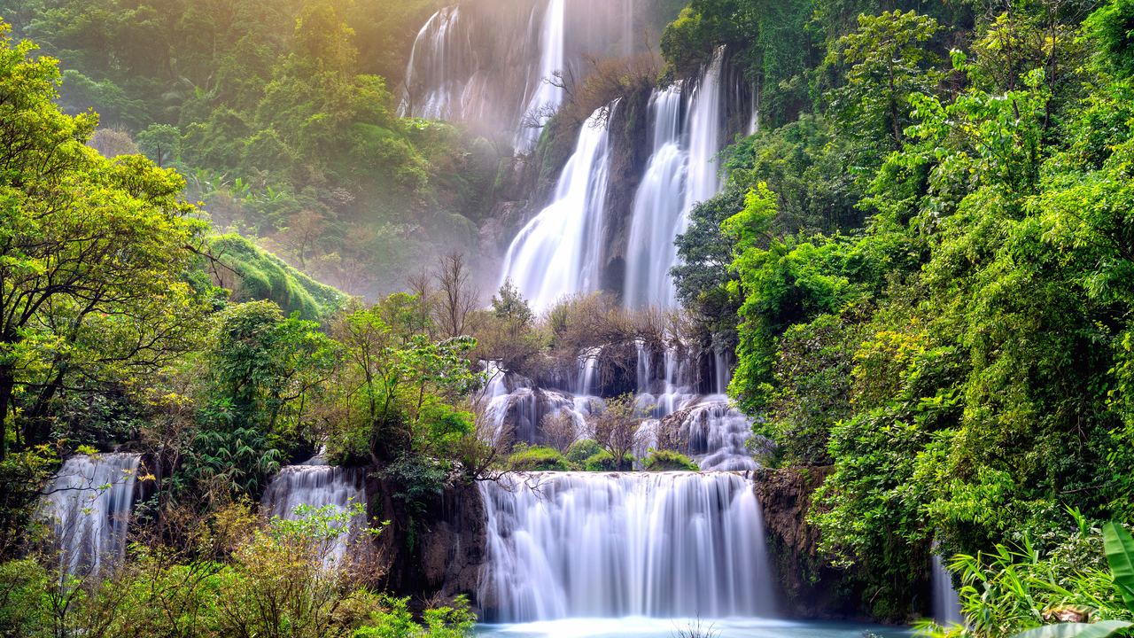 Thi Lo Su Waterfall in Tak province, Thailand, falling through forest in several tiers