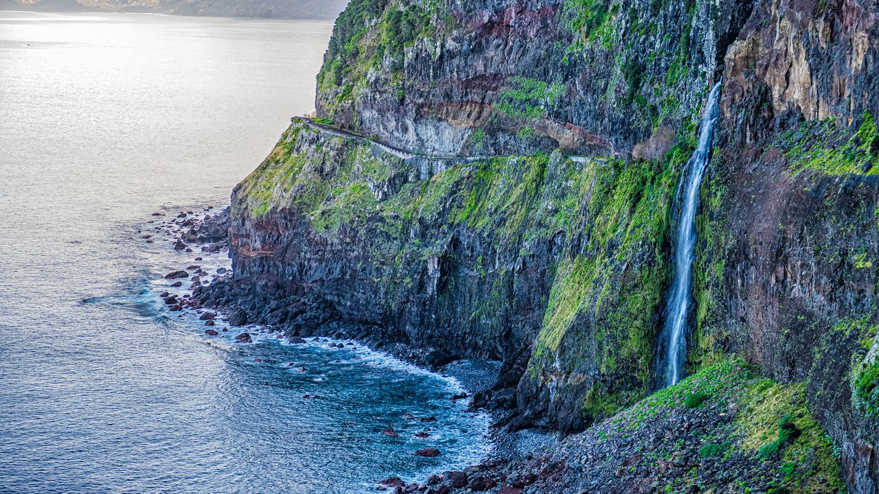 Véu da Noiva waterfall falling down a sea cliff on Madeira's north coast