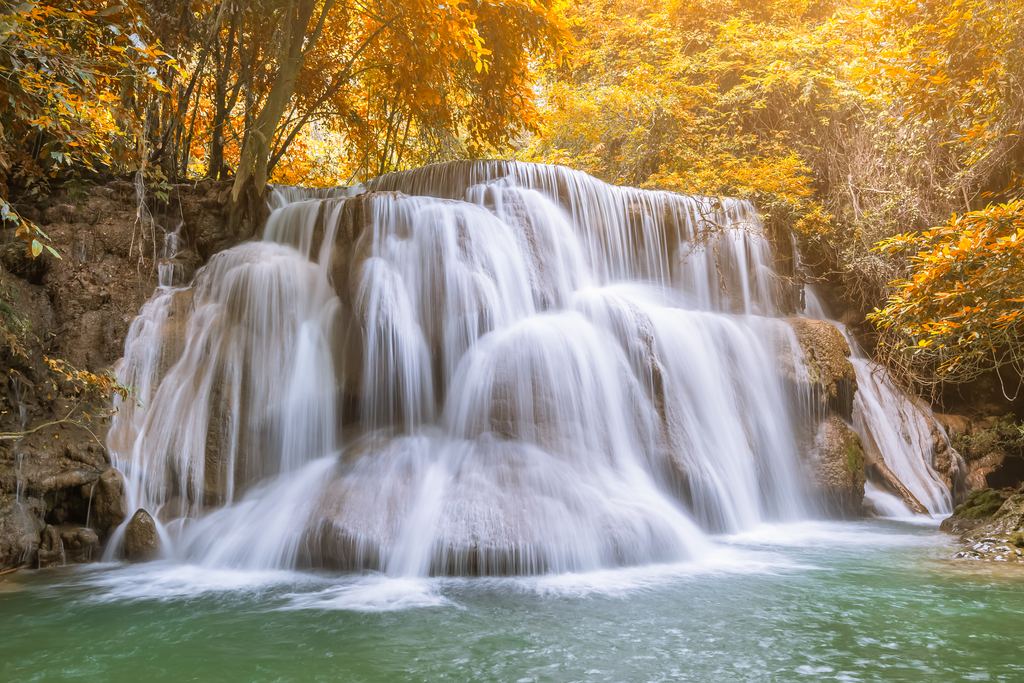 A tiered waterfall in autumn light in Khuean Srinagarindra National Park, Kanchanaburi, Thailand