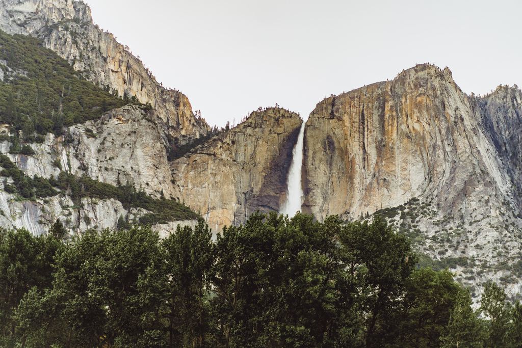 Yosemite Falls running as a thin ribbon of water between granite cliffs in Yosemite National Park